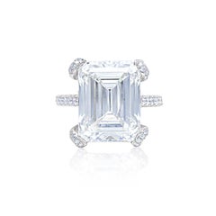 DIANA M. 18 kt white gold  ring featuring a center 10.76 ct emerald cut J-SI1