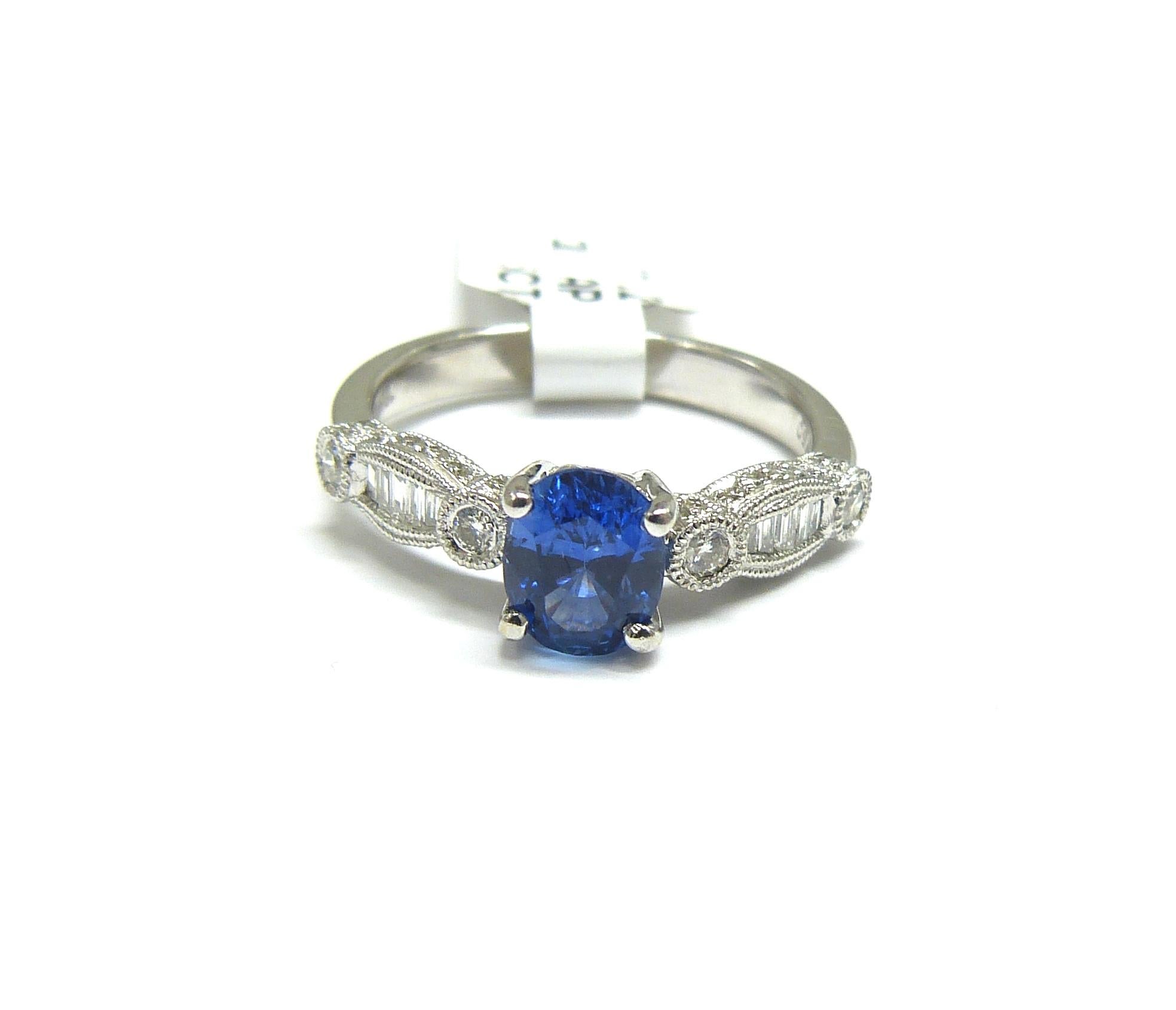 Modern Diana M. 18 kt white gold sapphire and diamond ring featuring a center 1.33 ct  For Sale