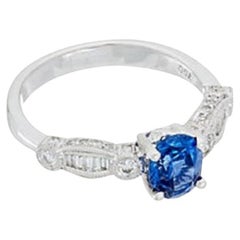 Diana M. 18 kt white gold sapphire and diamond ring featuring a center 1.33 ct 