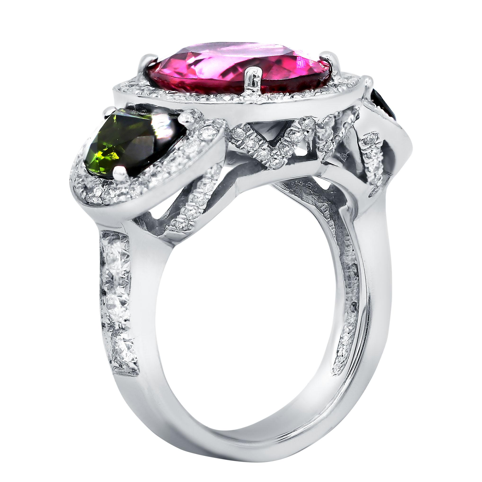 18 kt white gold tourmaline and diamond ring featuring a 5.62 ct oval cut pink tourmaline with two half-moon shaped green tourmalines totaling 3.73 cts surrounded by 1.50 cts tw of micropave round diamonds.
Diana M. is a leading supplier of