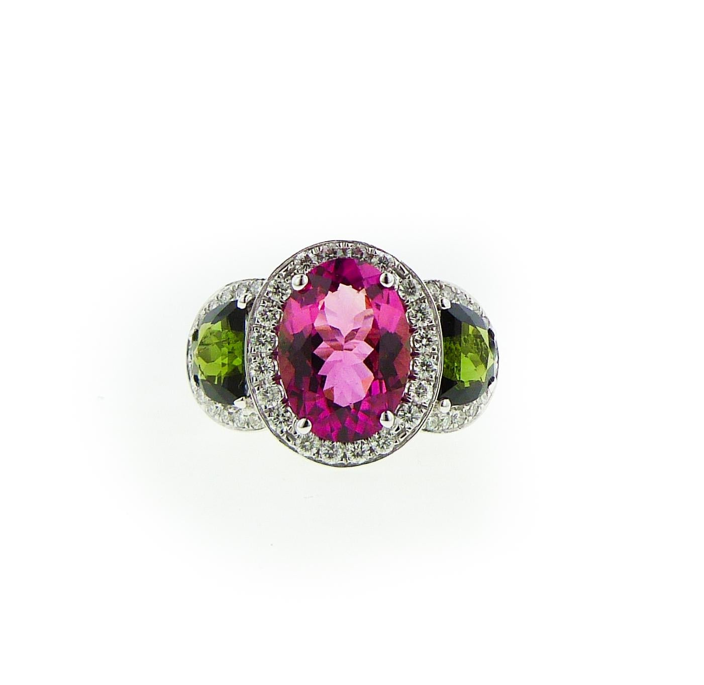 Modern Diana M. 18 kt white gold tourmaline and diamond ring featuring a 5.62 ct oval For Sale