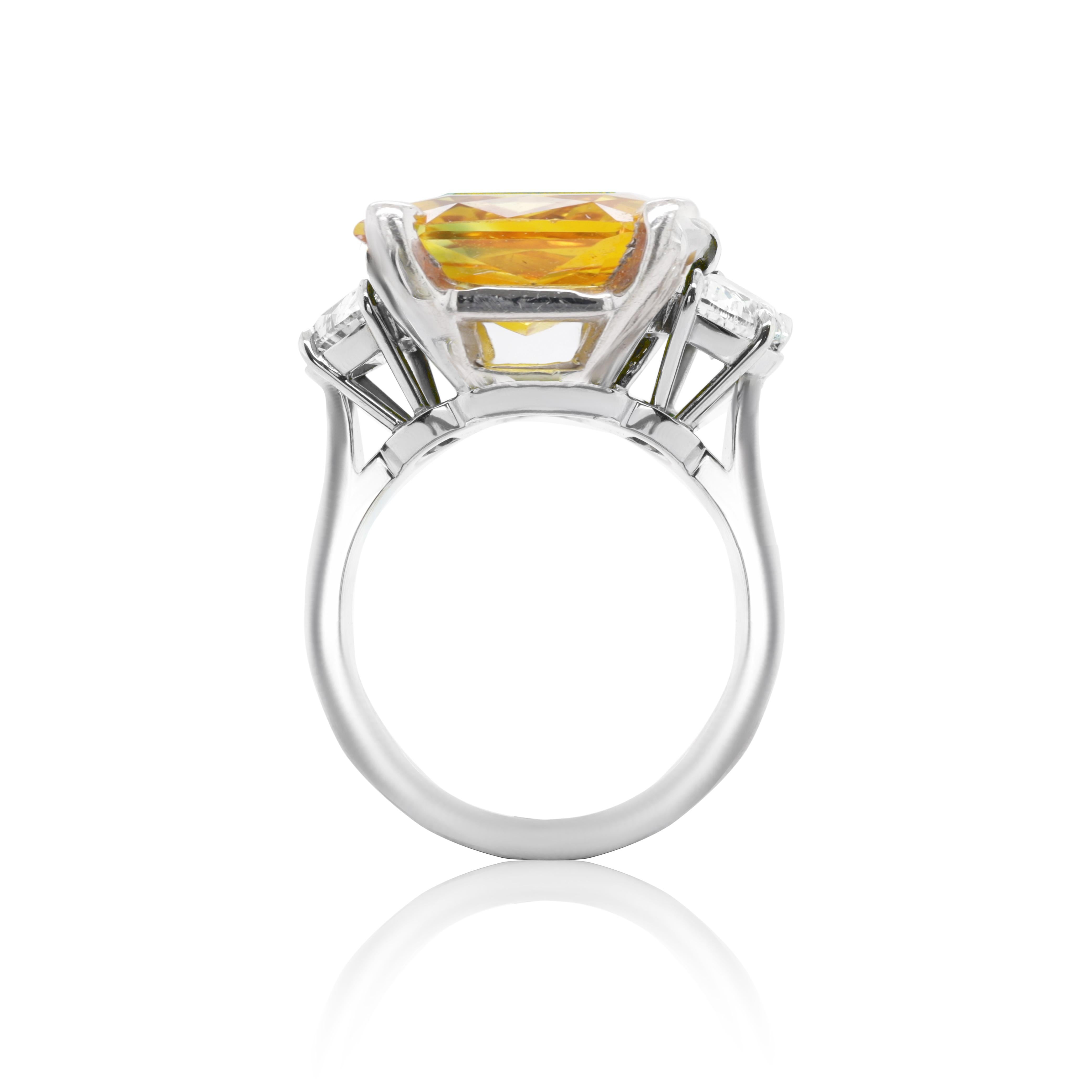 18 kt white gold sapphire and diamond ring featuring a 2.97 ct cushion cut yellow orange sapphire center with 2 baguette cut diamonds on the side totaling 0.85 cts of diamonds (C.Dunaigre Certified).
Diana M. is a leading supplier of top-quality