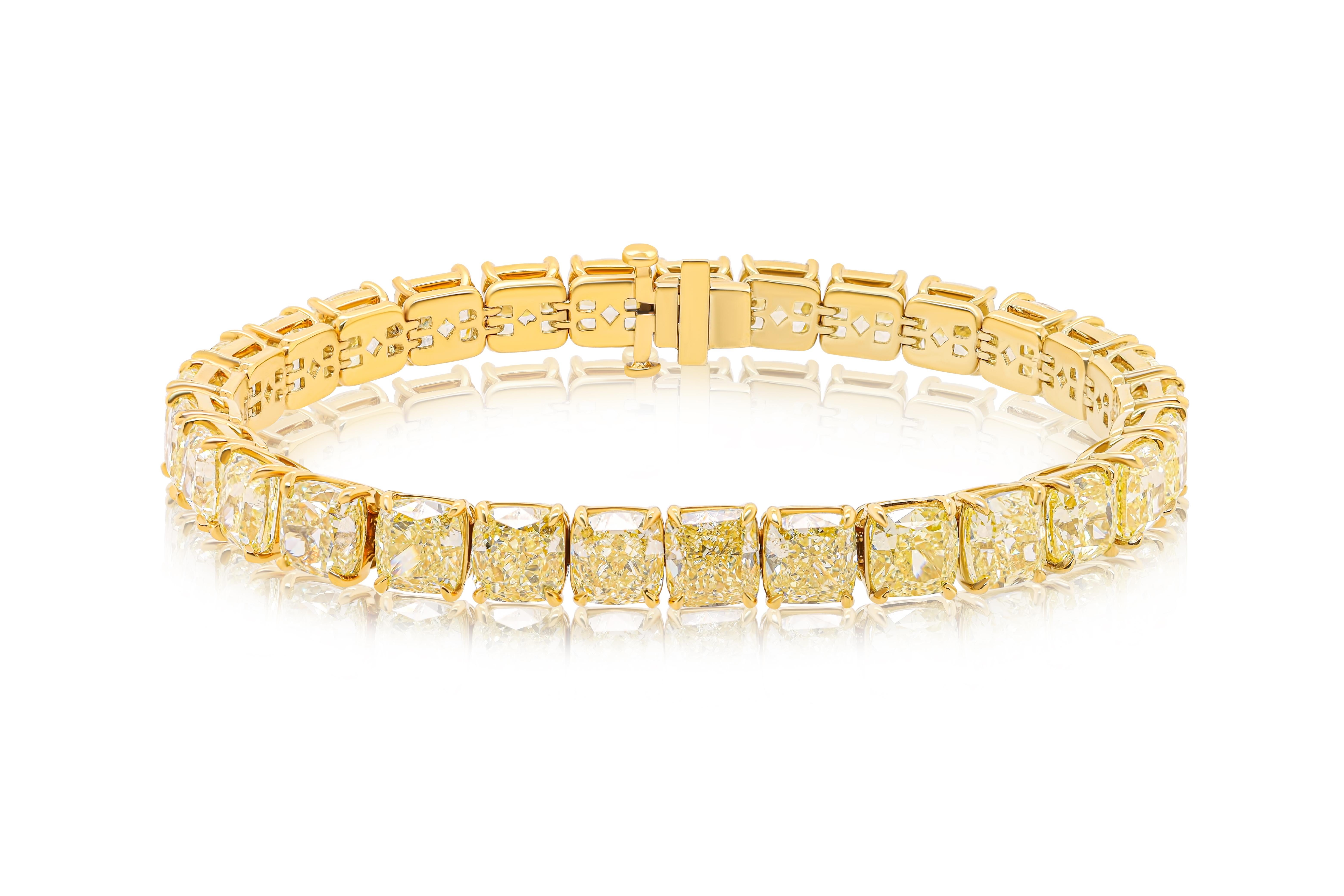 18 kt custom yellow gold 4 prong diamond eternity bracelet  35.07 cts GIA certified cushion cut diamonds 1-1.25 carat each Fancy Yellow VVS-VS 29 stones.Excellent cut.

