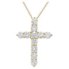 Diana M. 18 kt yellow gold, 1" diamond cross pendant adorned with 3.55 cts tw of