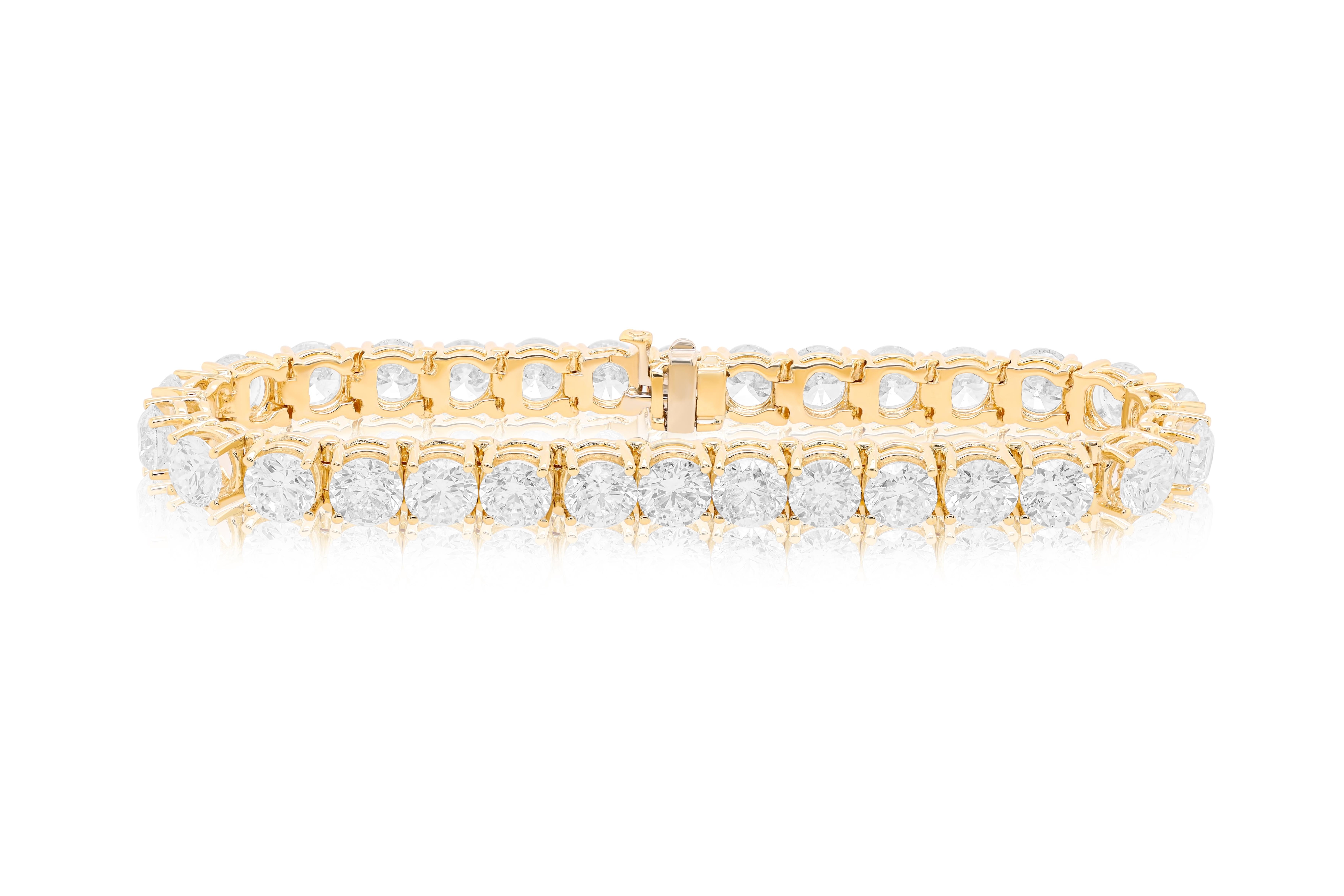 Custom 18 kt yellow gold 4 prong diamond tennis bracelet 21.35 cts of round diamonds 30 stones 0.71  each stone FG color SI clarity.  Excellent Cut.