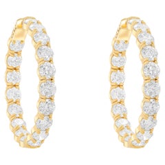 Diana M. 18 kt yellow gold inside-out hoop earrings adorned with 19.05 cts