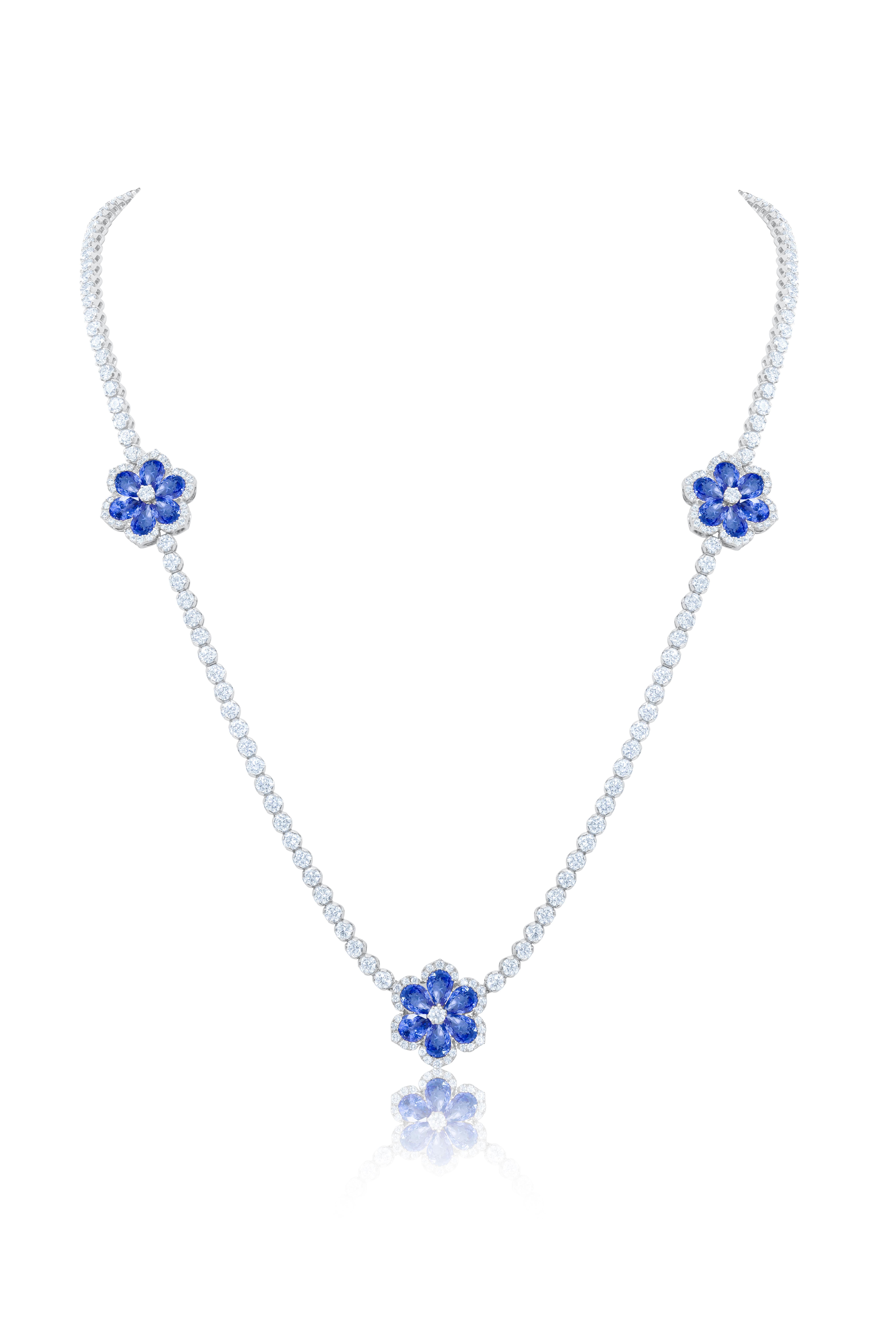 18 kt white gold sapphire and diamond long tennis necklace adorned with 13.78 cts tw of pear shaped sapphires in a flower shape and 22.51 cts tw of diamonds measuring 35.5