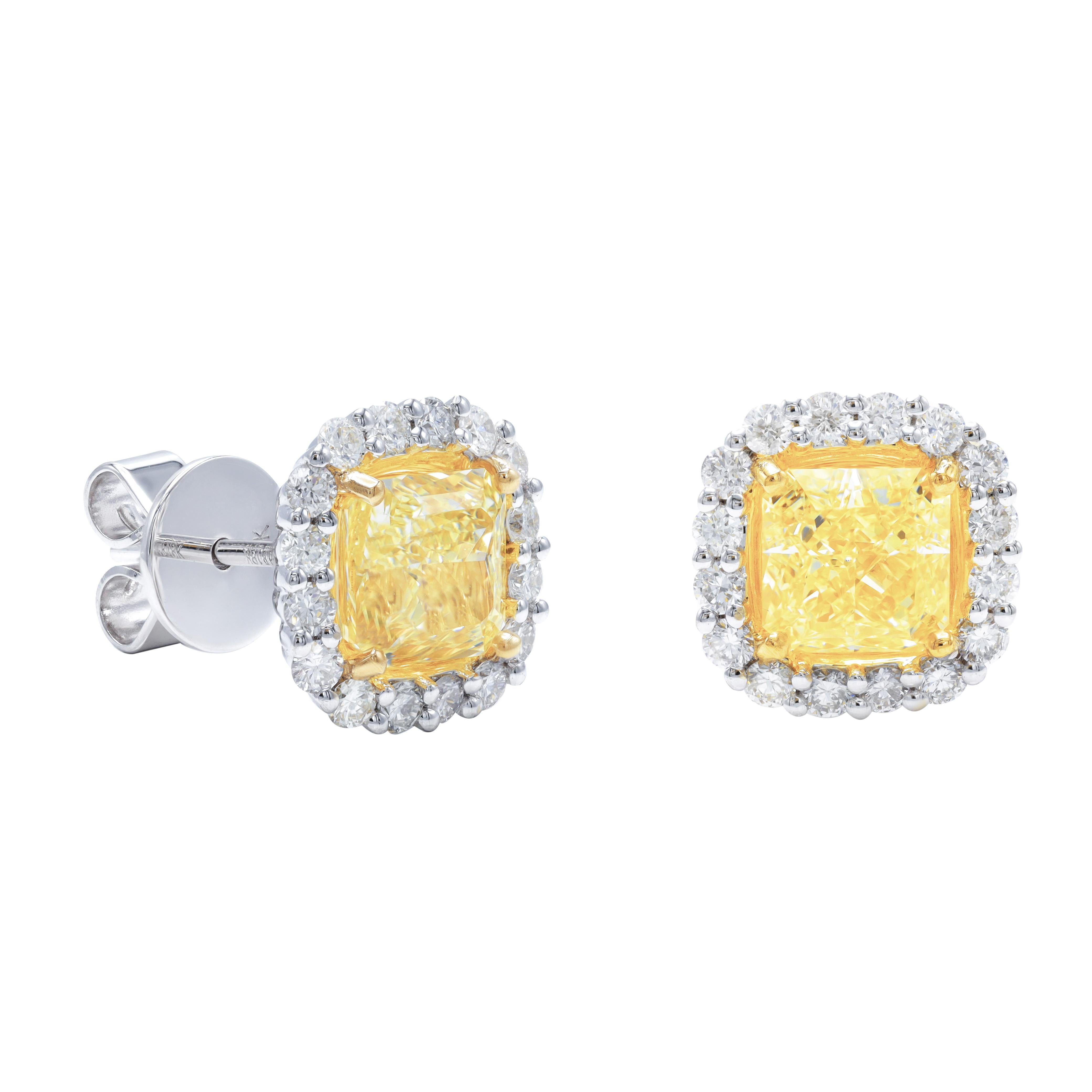 18kt white and yellow gold stud earrings featuring 2 GIA certified  cushion shape yellow diamond centers weighing 3.08 cts tw ( FY VS2-VS1 CUSHION SHAPE GIA (1.58CTS FY VS2 GIA#2437356971 & 1.50CTS FY VS1 GIA#2386923147 surrounded by 0.75 cts of