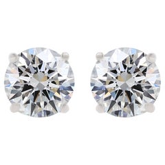 Used Diana M. 4 Prong Mounting Near Colored White  5.62 Carat Diamond Studs