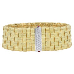  18KT Roberto coin bracelet woven design with ruby and diamond accent 