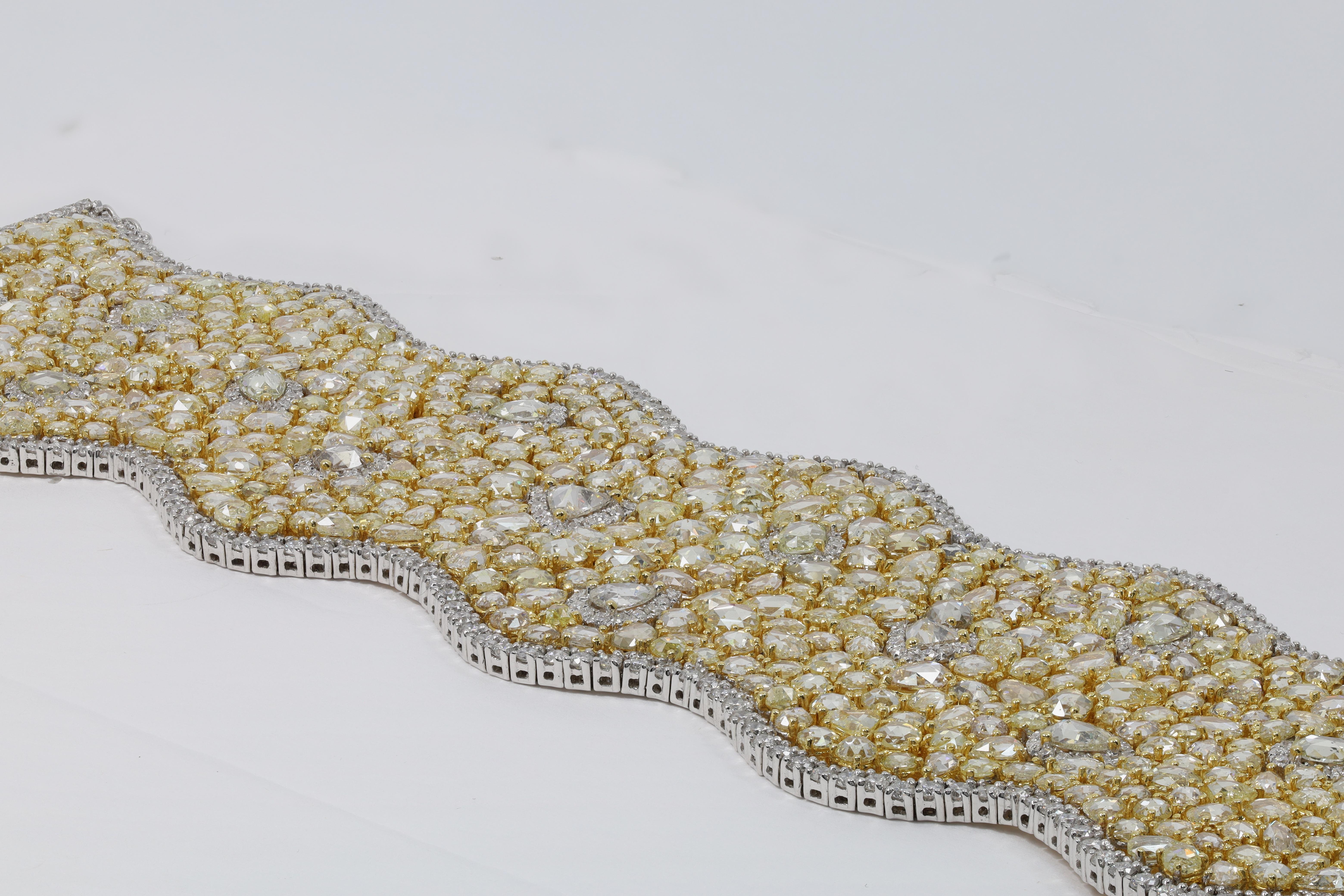 18kt custom white and yellow gold bracelet featuring 56.67 cts of cts of yellow diamonds and 10.00 cts of white diamonds
