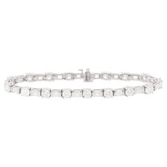 Diana M. 18kt white bracelet 7.00ct baquette and round diamonds 34 stones
