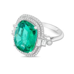 Diana M 18kt White Gold 7.04ct Emerald and 1.00Cts Diamond Halo Ring