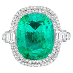 Diana M 18kt White Gold 7.04ct Emerald and 1.00Cts Diamond Halo Ring
