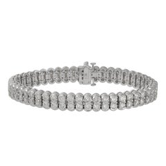 DIANA M. 18kt white gold bracelet featuring 2 rows of 11.70 cts round diamonds