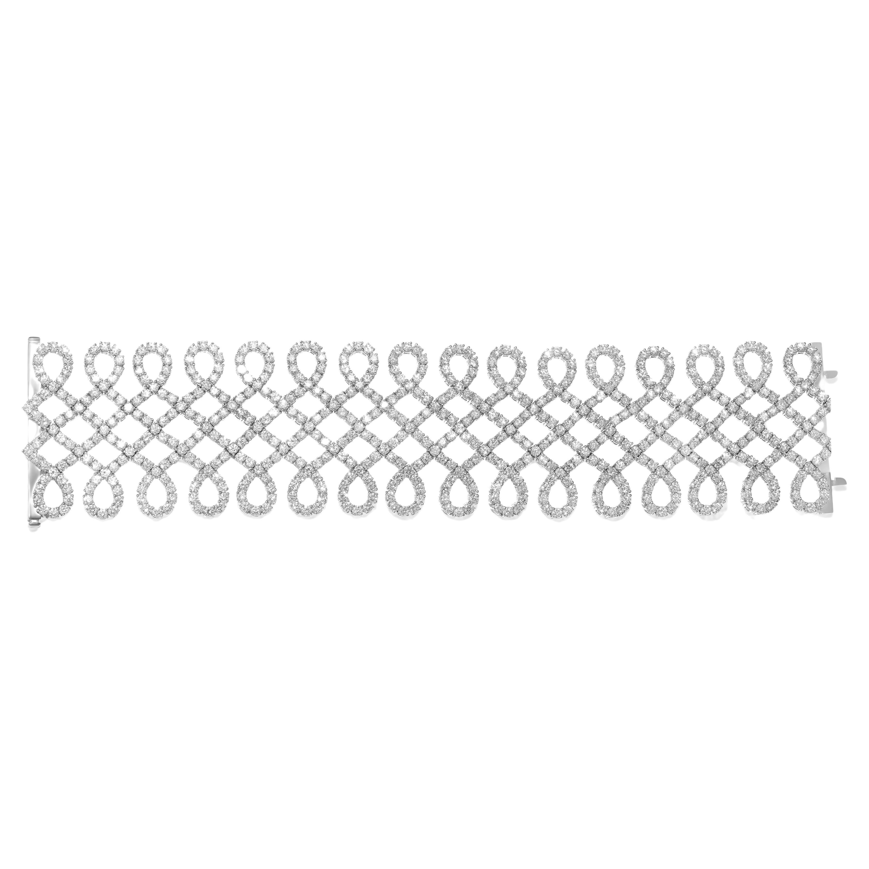 Diana M. 18kt white gold crisscross bracelet featuring 29.00 cts of diamonds For Sale