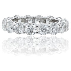 Diana M. 18KT WHITE GOLD ETERNITY BAND, 6.61CTS DIAMONDS (TCW)