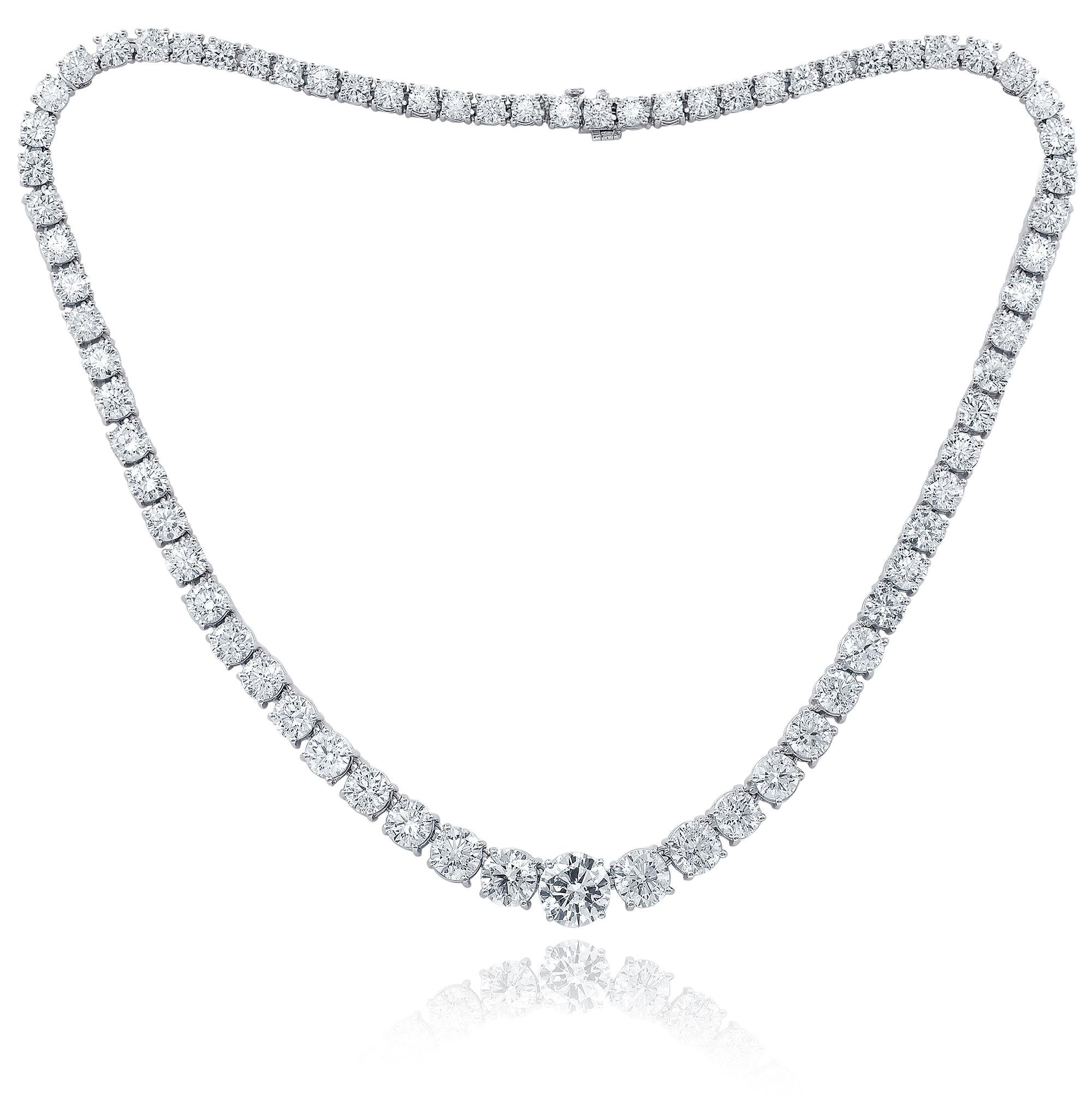 Custom 18k white gold graduated tennis necklace 24.15 cts  round brilliant diamonds set in a 4 prong setting 89 stones 0.27 each FG color SI clarity. Excellent  cut. 
