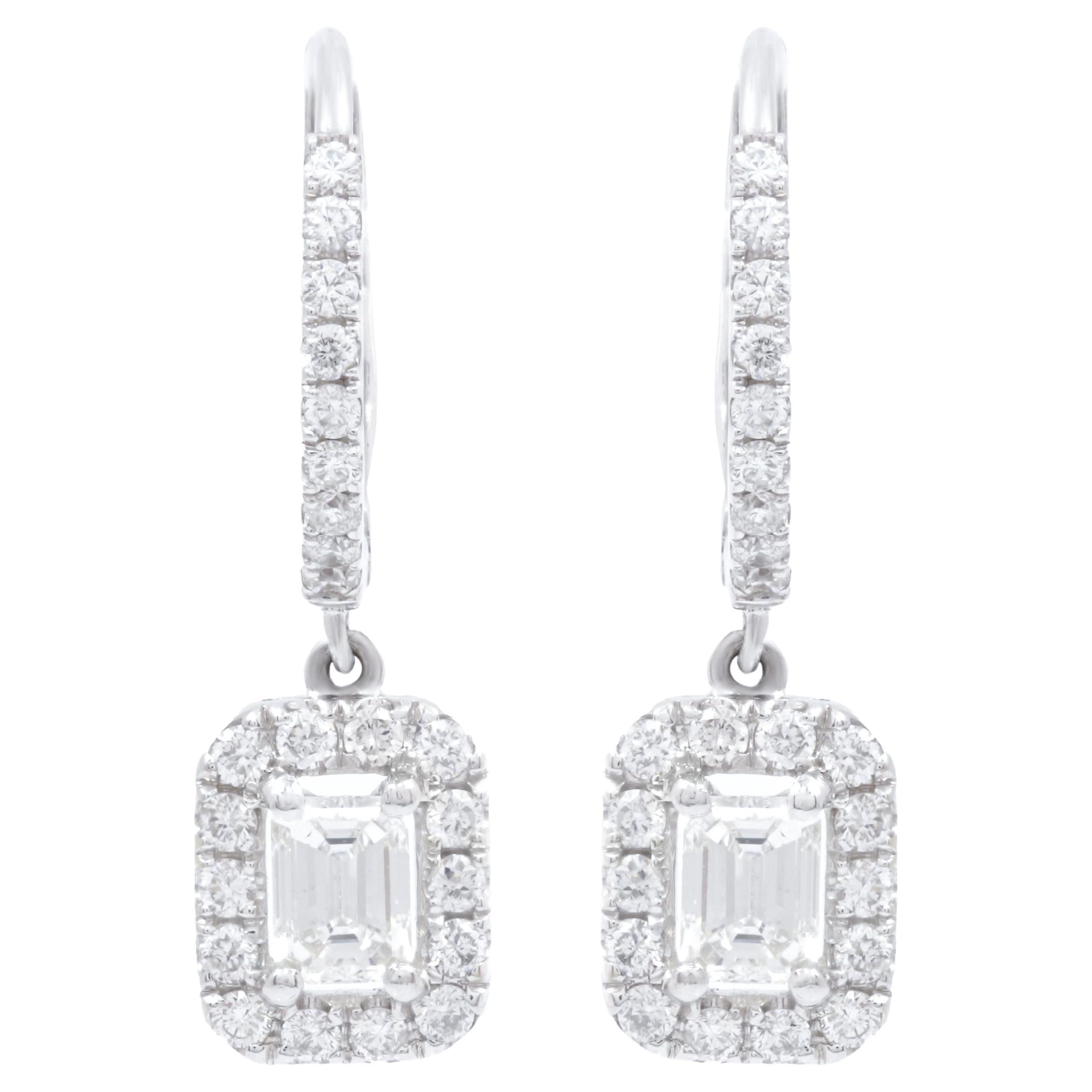 Diana M. 18kt white gold hanging earrings featuring 1.00cts of daimnds w/emerald For Sale