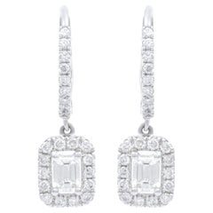 Diana M. 18kt white gold hanging earrings featuring 1.00cts of daimnds w/emerald