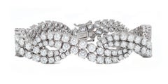 Diana M. 18kt white gold infinity bracelet featuring 18.06 cts tw of  diamonds