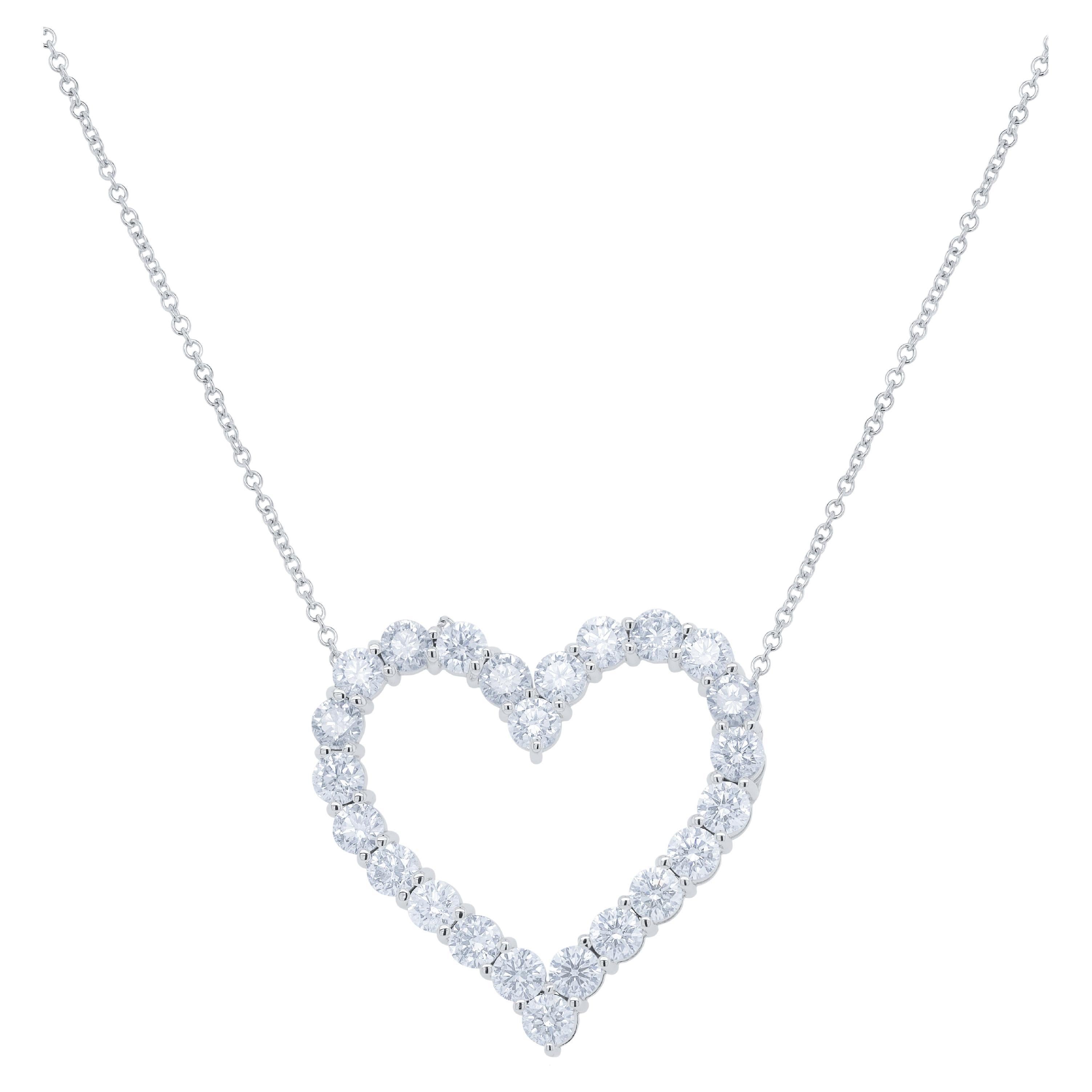 Diana M. 18kt white gold open heart pendant featuring 2.30 cts of round diamonds For Sale