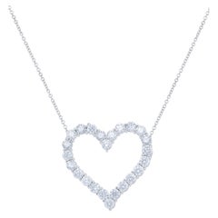 Diana M. 18kt white gold open heart pendant featuring 2.30 cts of round diamonds
