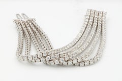 Diana M. 18kt white gold tennis bracelet featuring 5 rows of 36.00 cts round dia