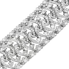 Diana M. 18kt white gold wide, flexible fashion heart bracelet featuring 32.50ct