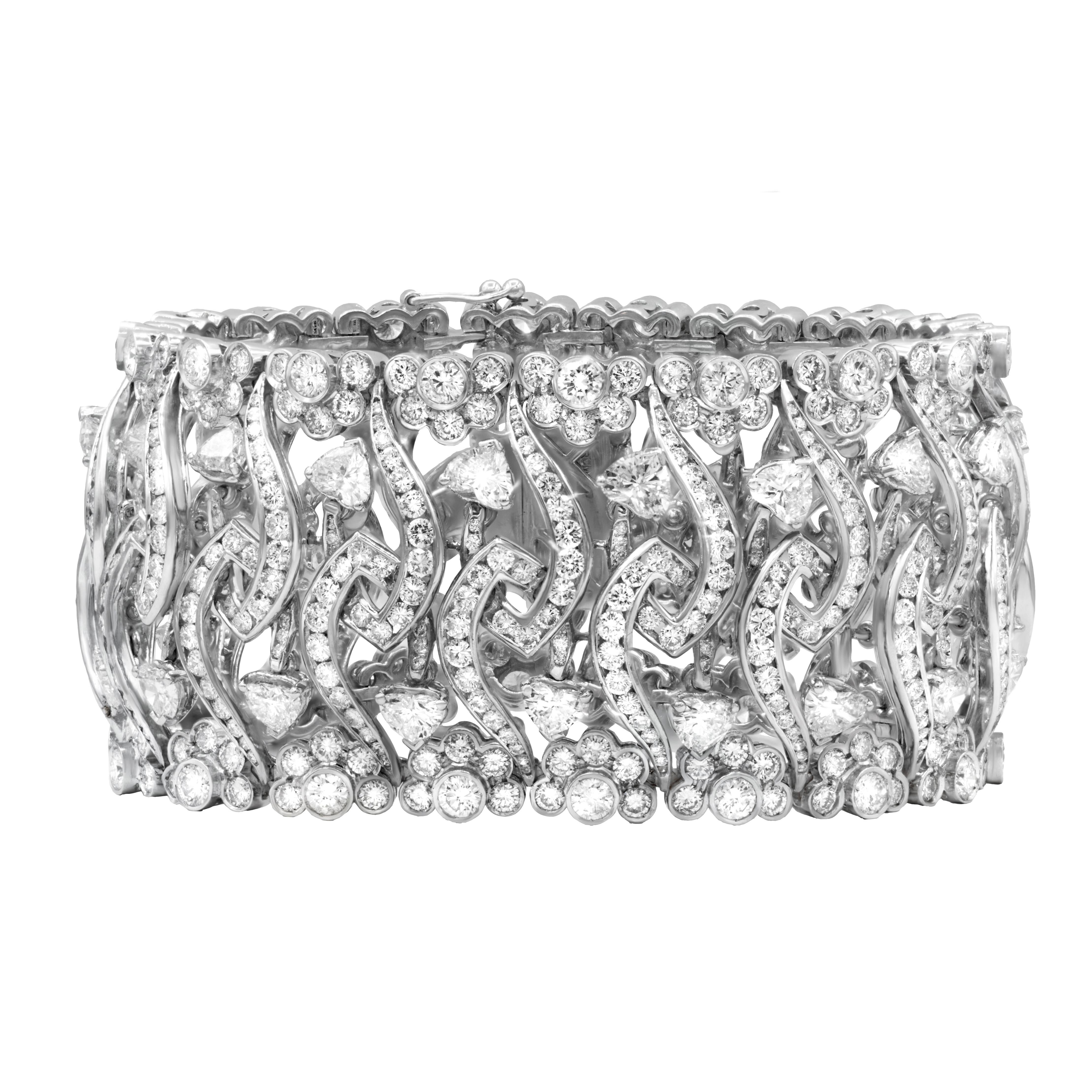 Modern Diana M. 18kt white gold wide, flexible fashion heart bracelet featuring 32.50ct For Sale