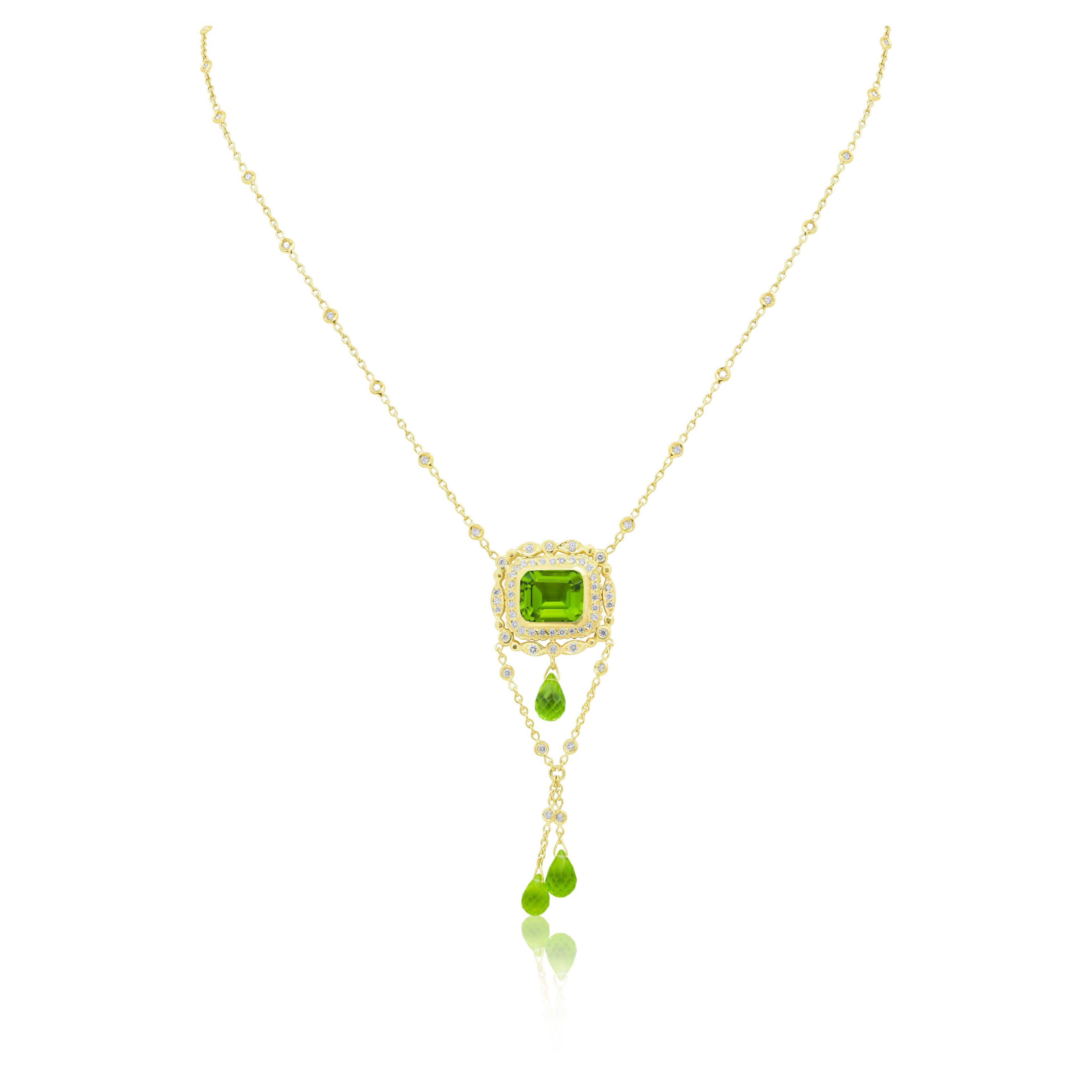 18kt yellow gold diamond pendant with emerald cut peridot 8.00ct and 1.30cts of diamonds with diamonds by the yard chain all one piece with 3 dangling briolette’s

Diana M. is a leading supplier of top-quality fine jewelry for over 35 years.
Diana M