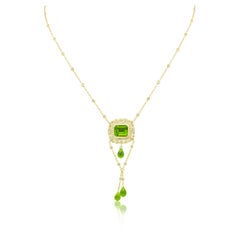 Diana M. 18kt yellow gold diamond pendant with emerald cut peridot 8.00ct