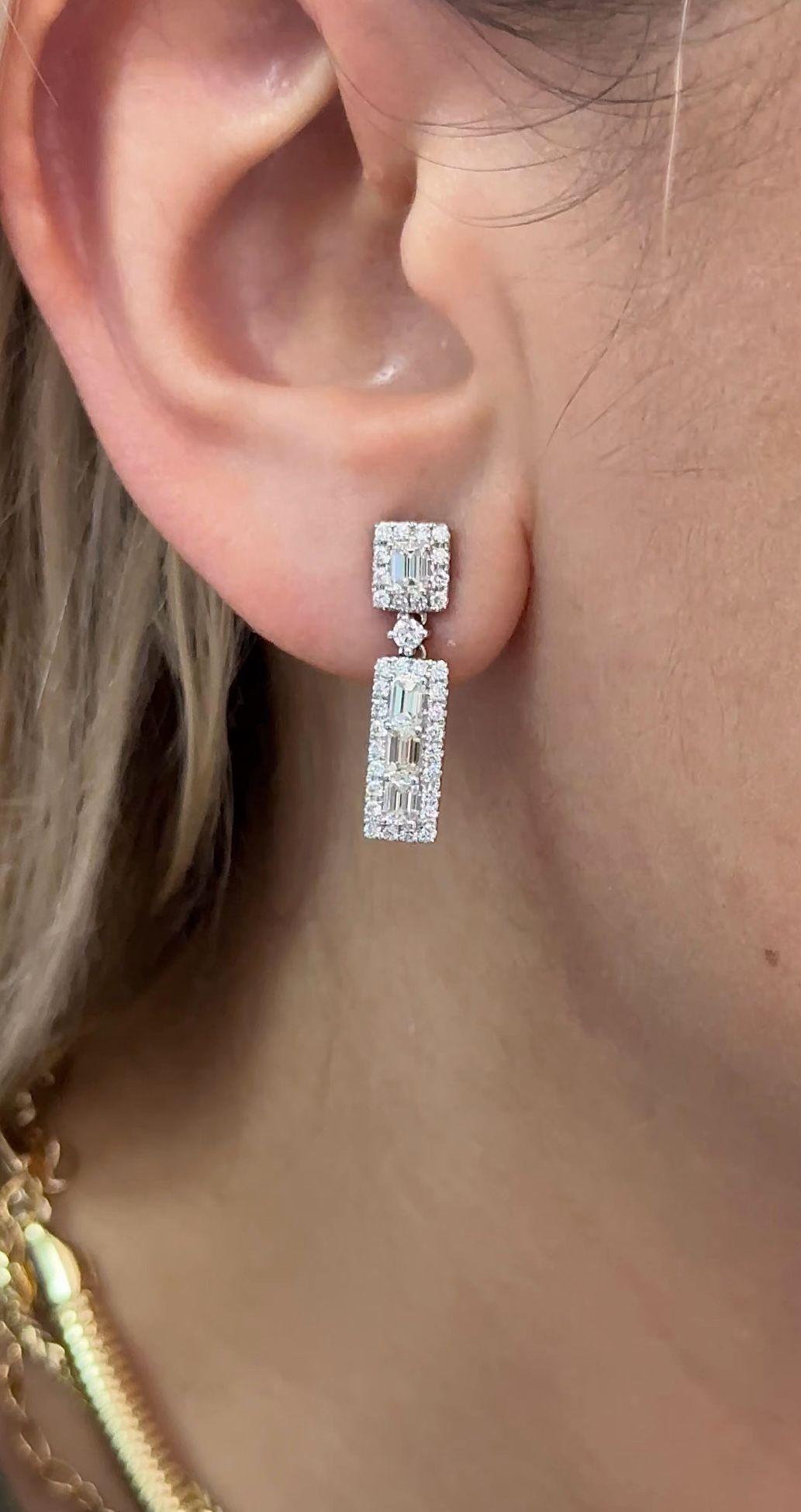 18 kt white gold diamond earrings adorned with baguette cut diamonds surrounded by round diamonds totaling 2.20 cts (HI, VS2-SI1)