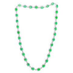 Diana M. 22.54 Carat Oval Emerald and Diamond Halo Necklace in White Gold