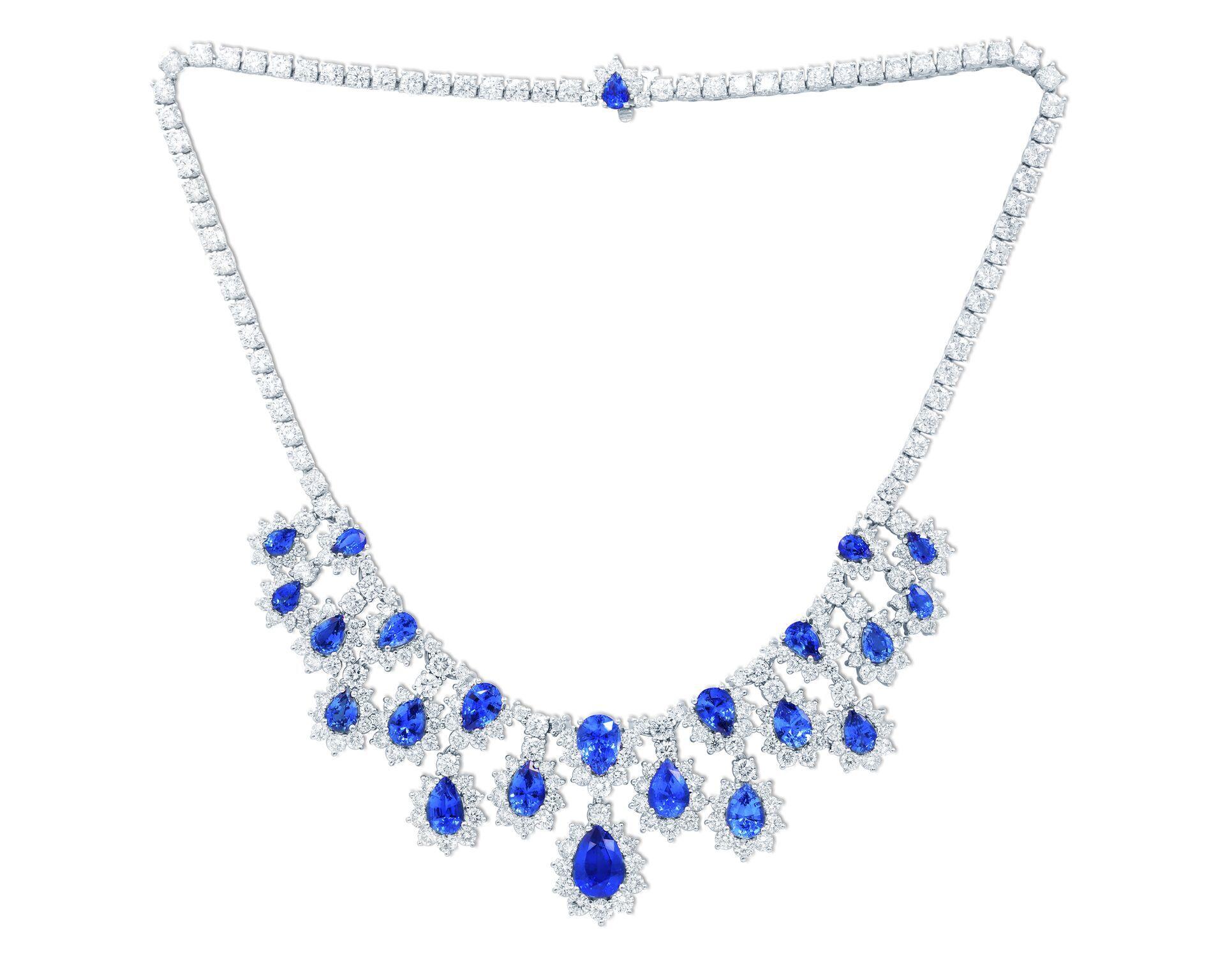 18kt white gold sapphire and diamond necklace, features 27.36ct of pear shape sapphires and 30.00 ct of round diamonds going all the way around.