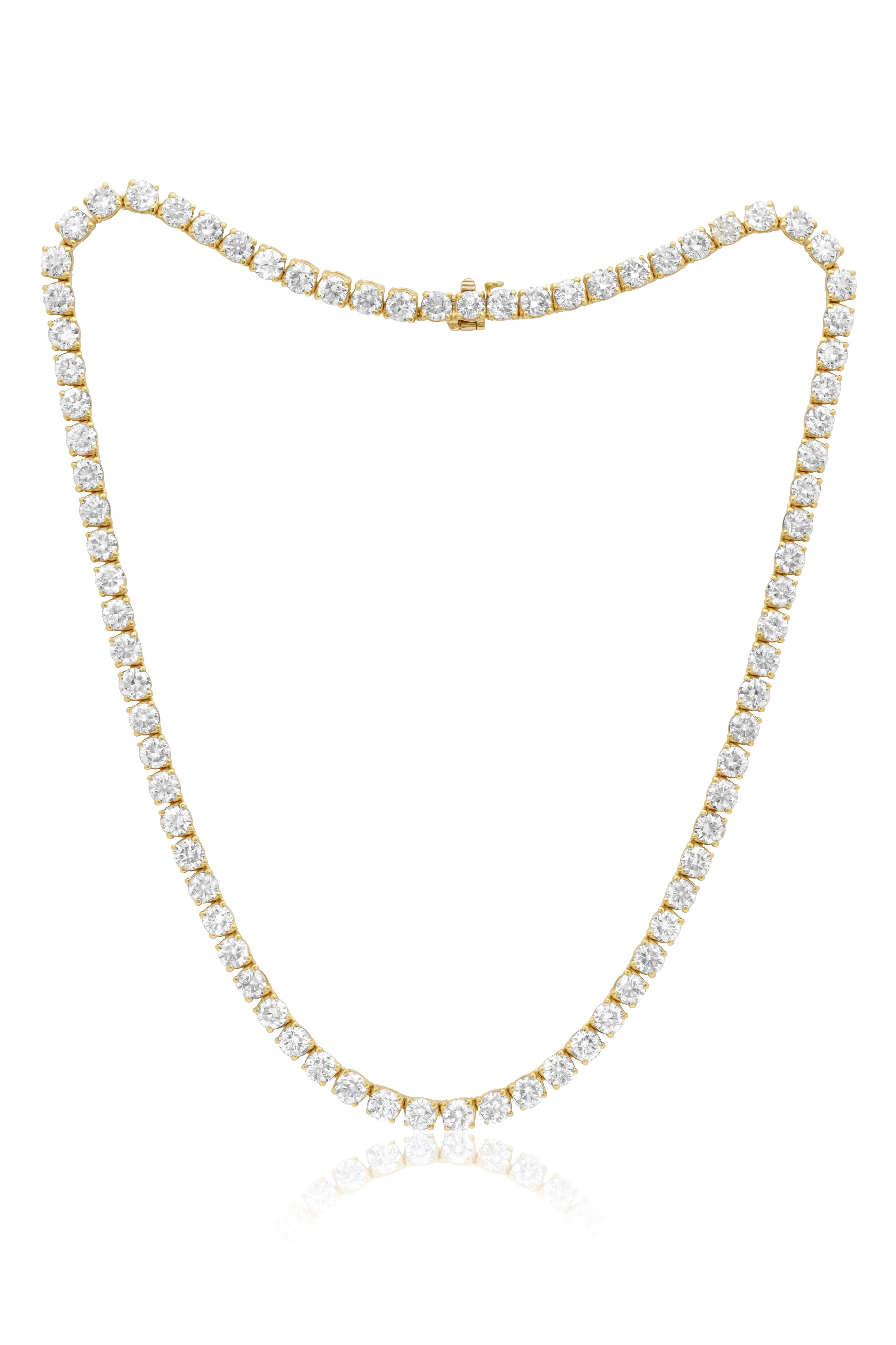 18 kt yellow gold 4 prong diamond tennis necklace containing 28.70 cts tw of brilliant cut round diamonds 