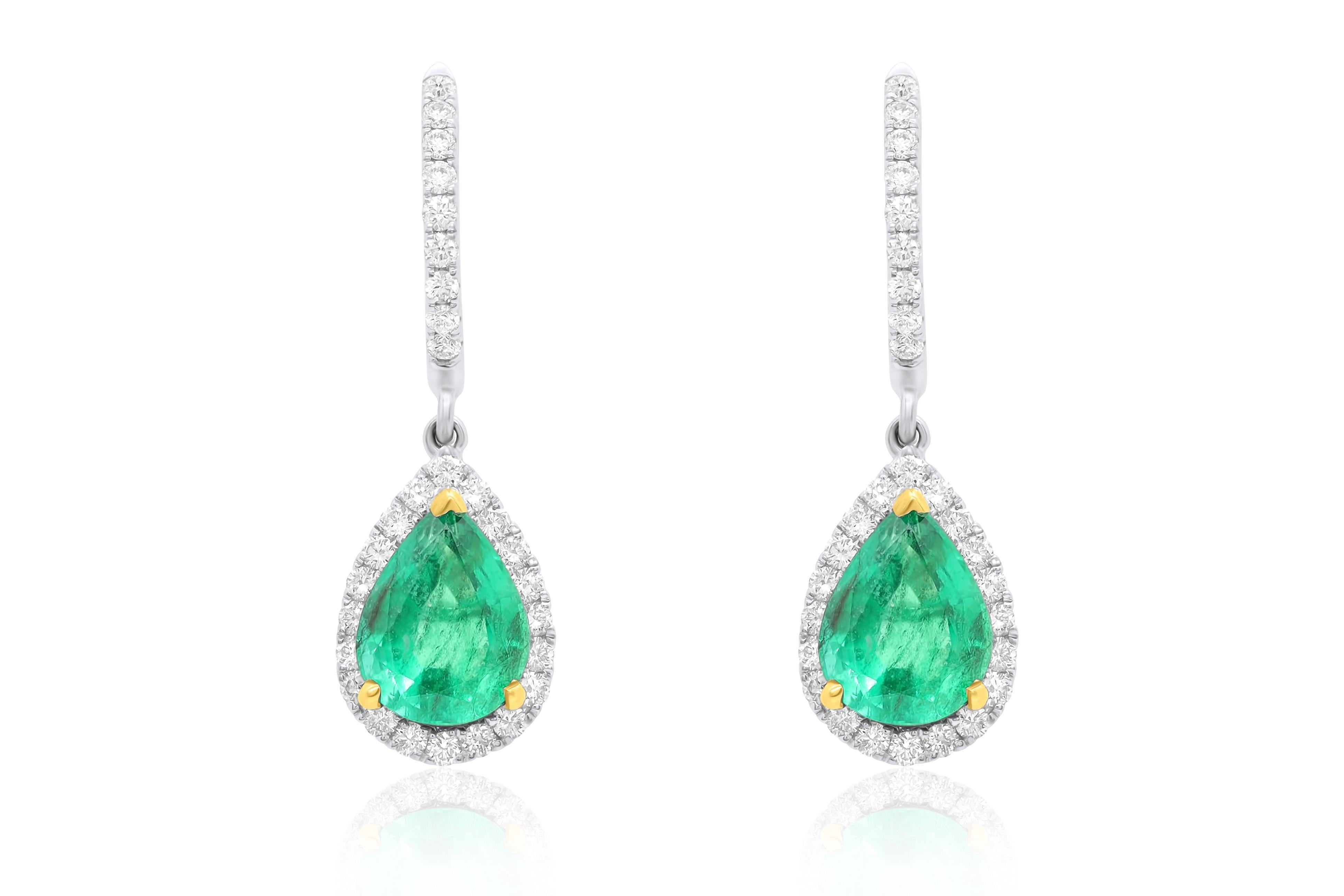 18kt white gold fashion earrings center stone emerald pear shape 2.88 cts with 0.70 cts diamond setting.