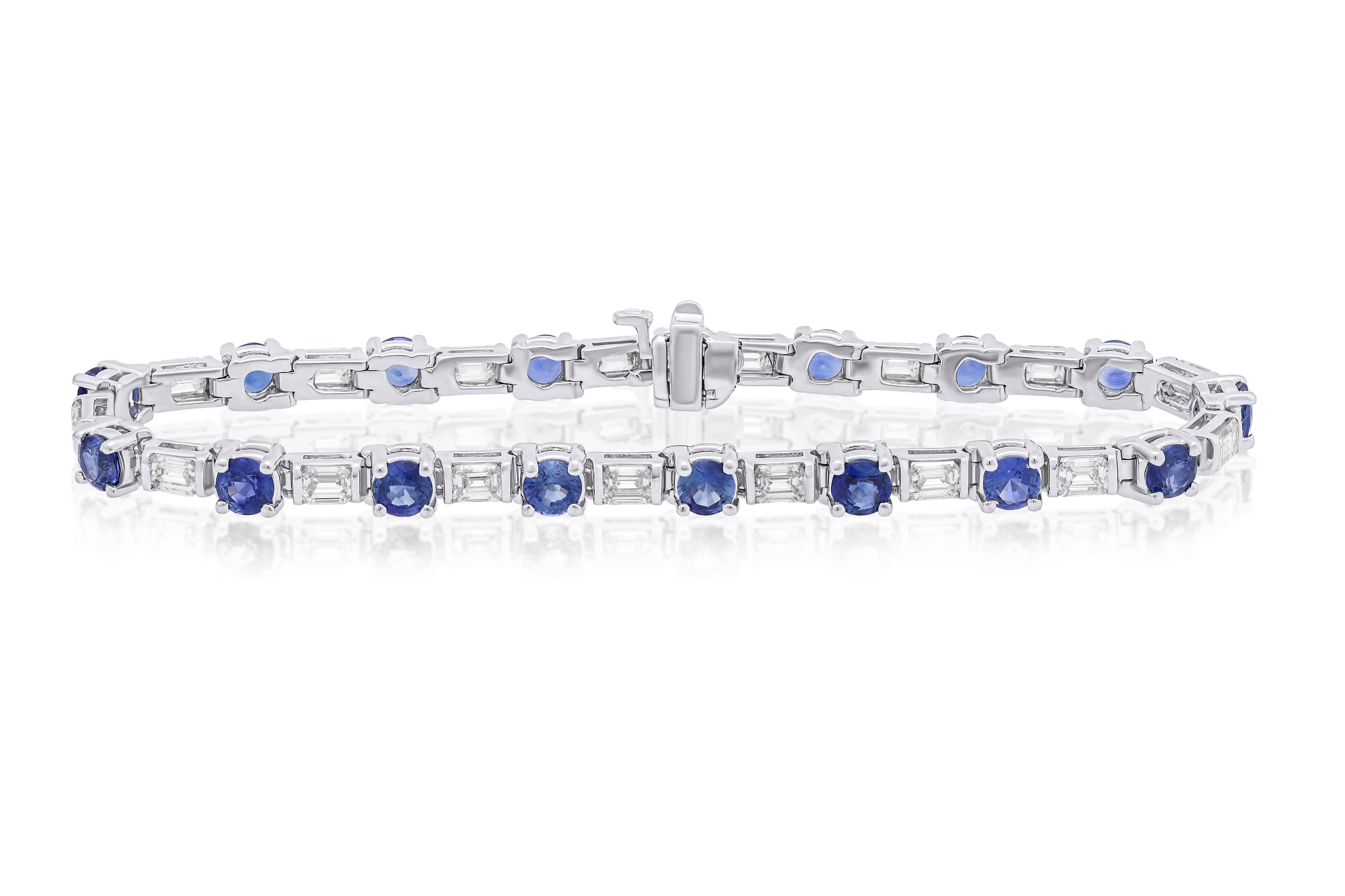 18 kt white gold sapphire and diamond eternity bracelet adorned with 5.90 cts tw of round sapphires separated by 4.45 cts tw of baguette cut diamonds