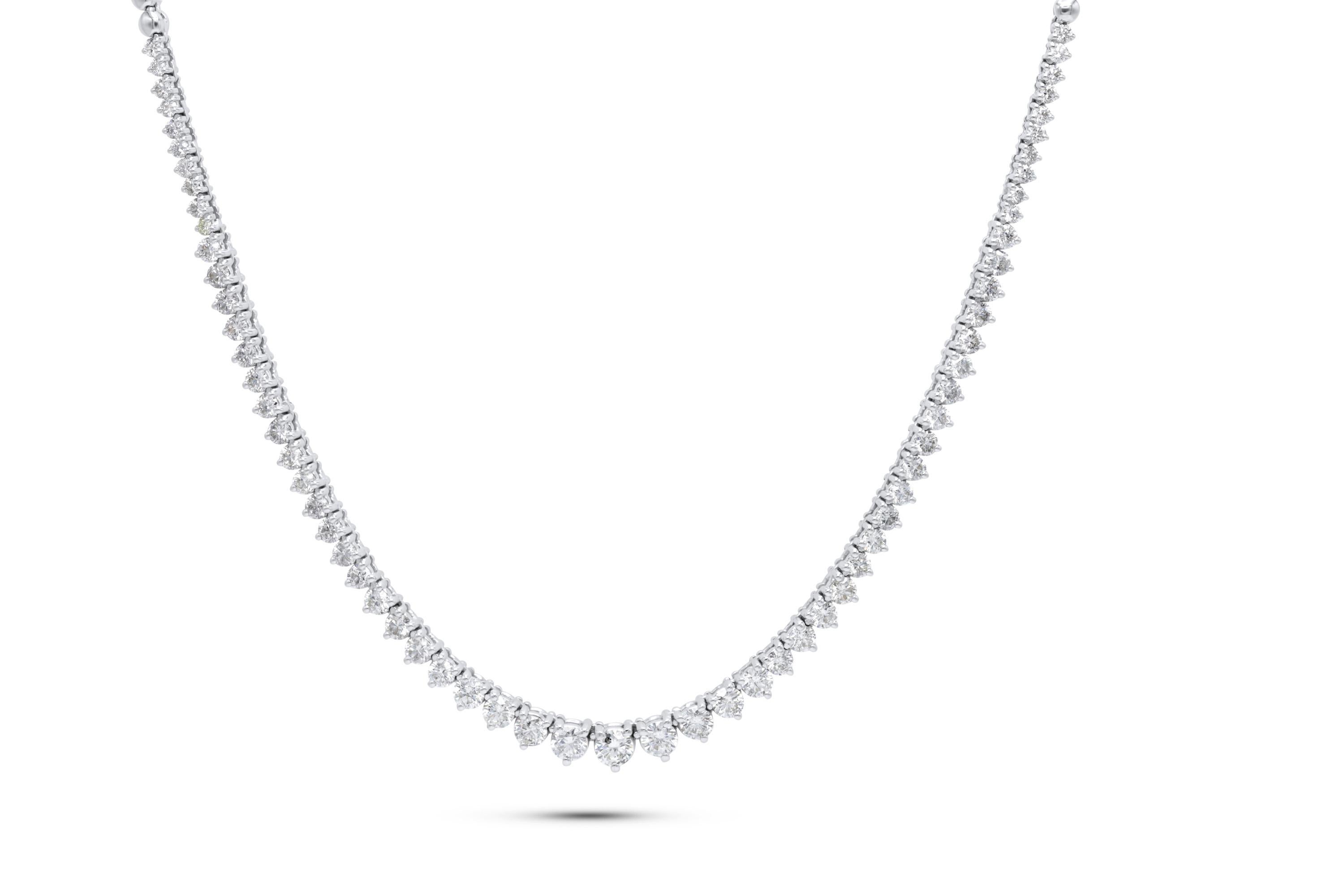 Custom 18k white gold graduated half way diamond tennis necklace containing 5.15 cts of round brilliant cut diamonds.Color FG SI clarity. Excellent cut 