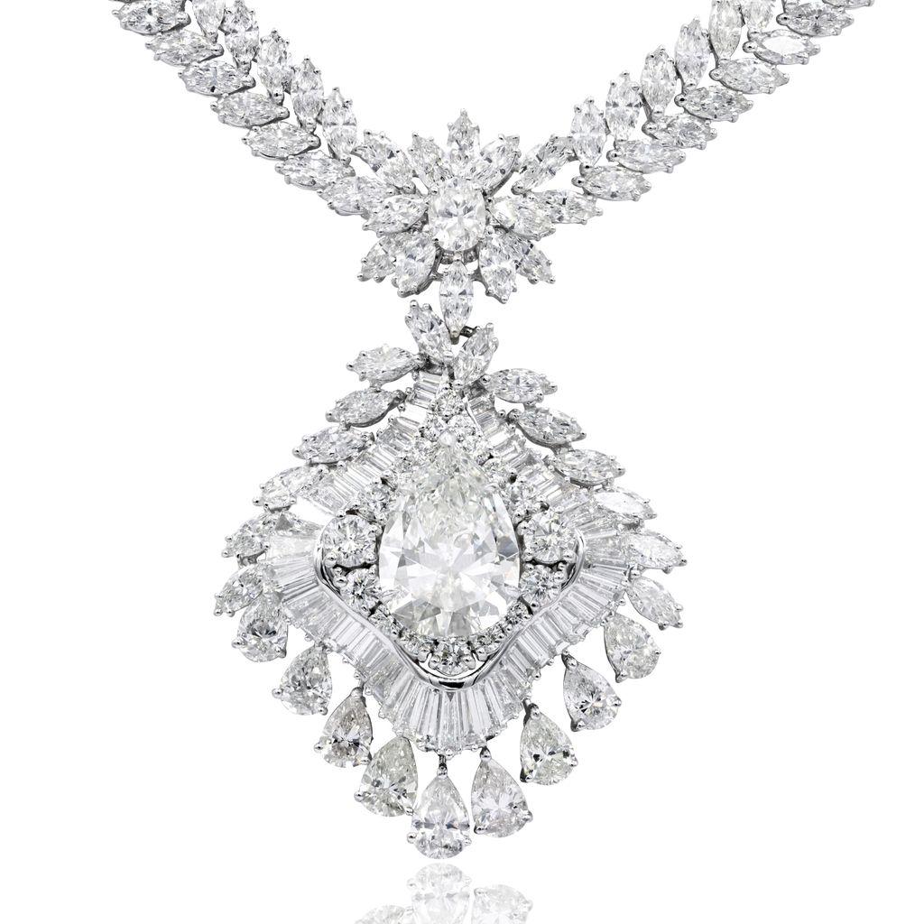 18kt white gold fashion necklace featuring a GIA certified pear shape diamond (PSC258-K-VS2) surrounded by multiple shapes of diamonds on the the pendant and 2 rows of pear and marquise diamonds (total weight 56.01 cts)