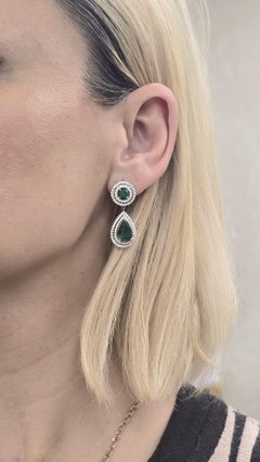 Diana M. 7.64Cts. Pear Shape and Emerals Earrings