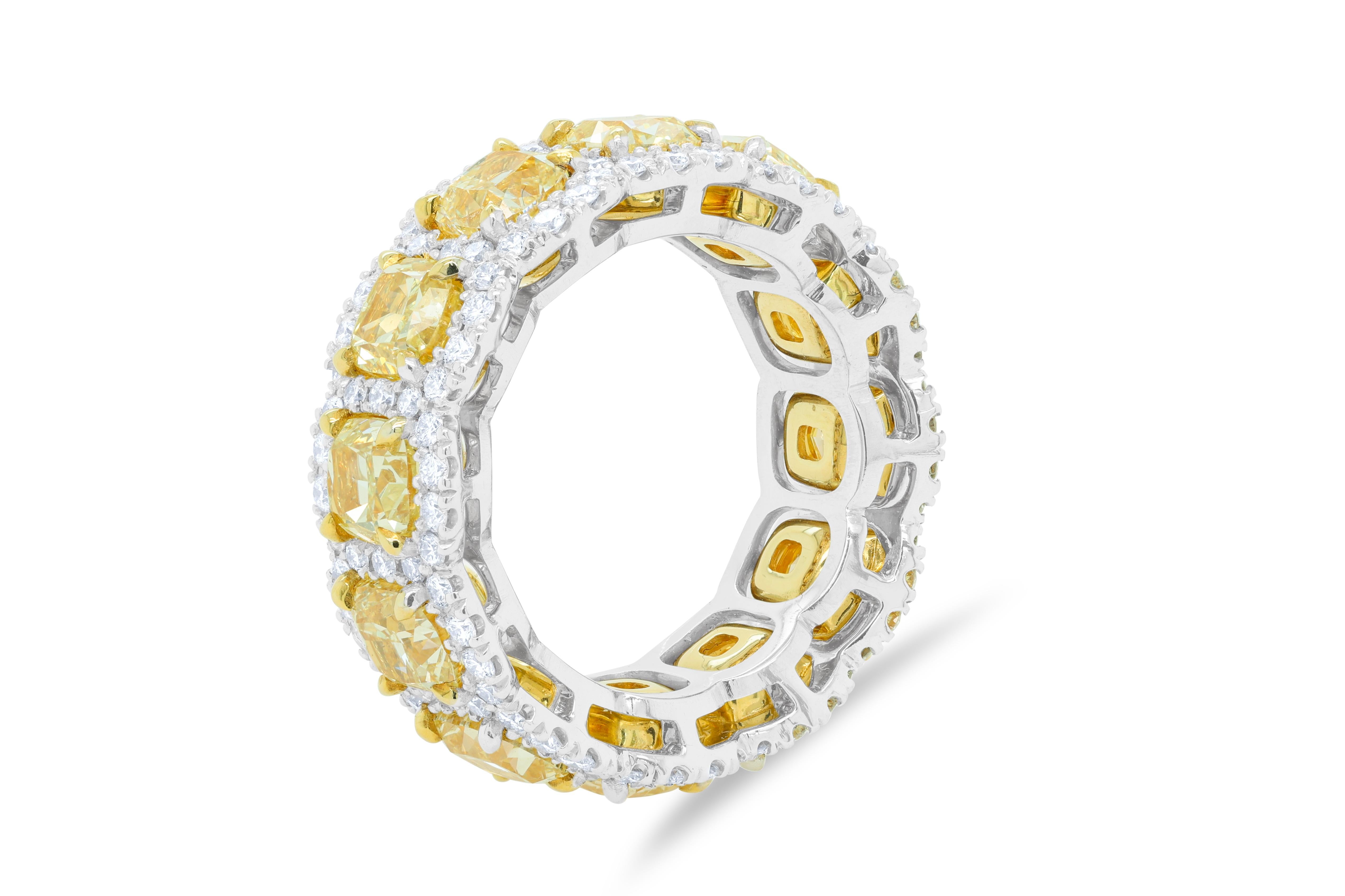  18 Kt yellow gold and platinum diamond eternity wedding band with 12 fancy yellow cushion diamonds in halo setting, featuring 8.40 cts fancy yellow diamond and 1.40 cts white diamonds 
