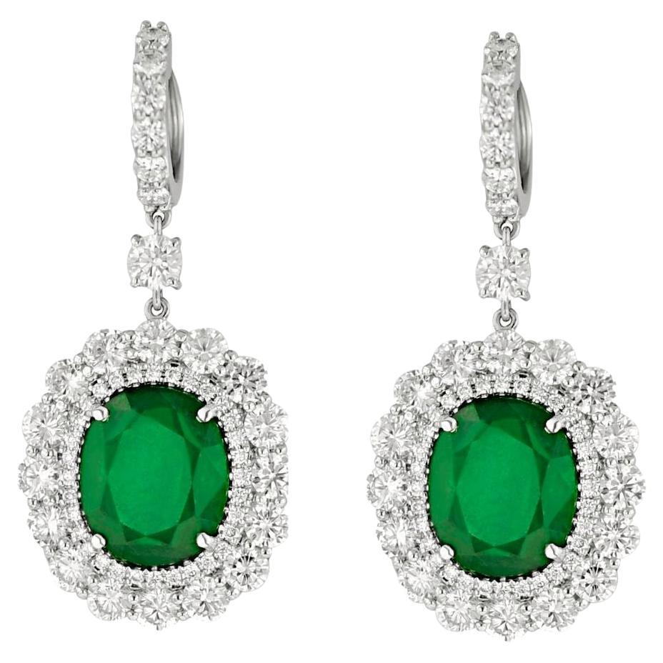 Diana M 9.21cts Oval Shaped Emerald & 6.00cts Diamond Halo Drop Earrings For Sale