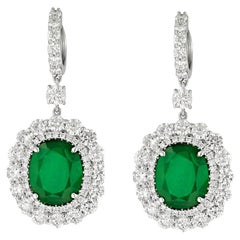 Diana M 9.21cts Oval Shaped Emerald & 6.00cts Diamond Halo Drop Earrings