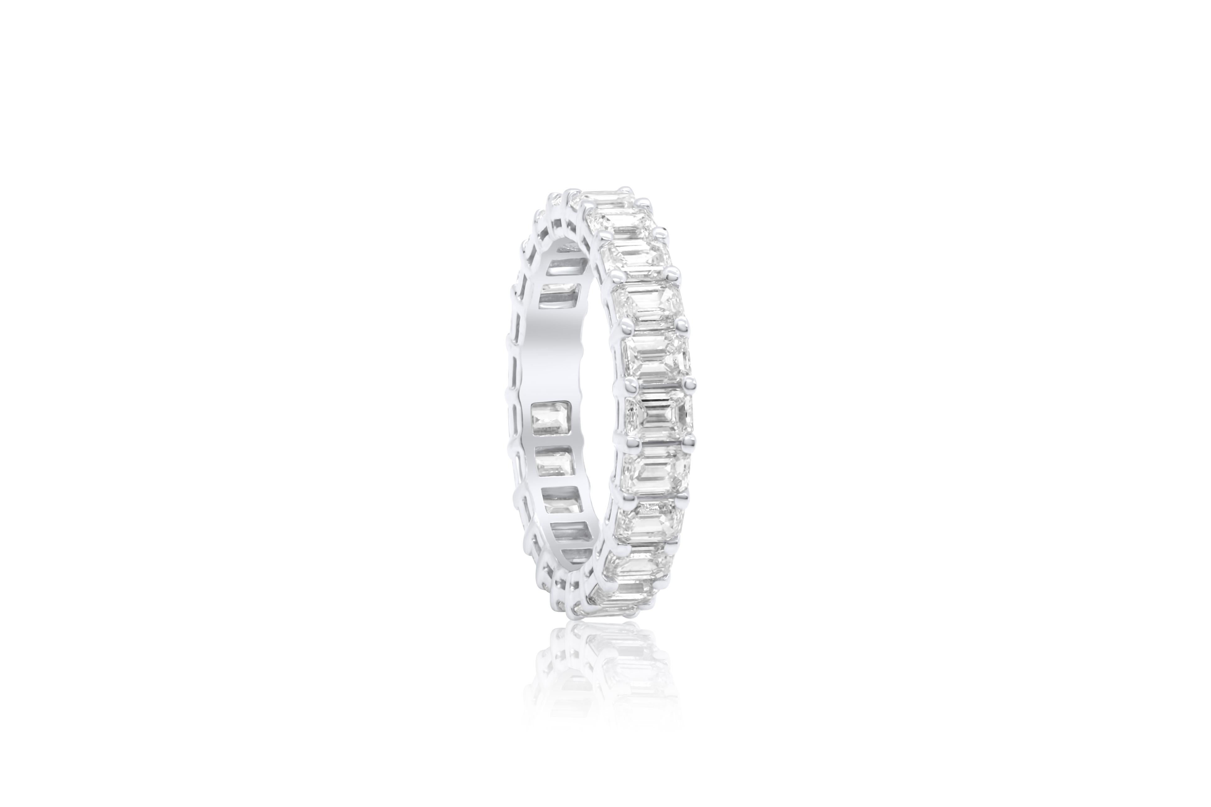 18 kt white gold diamond ring with eternity band design adorned with 3.75 cts tw emerald cut diamonds