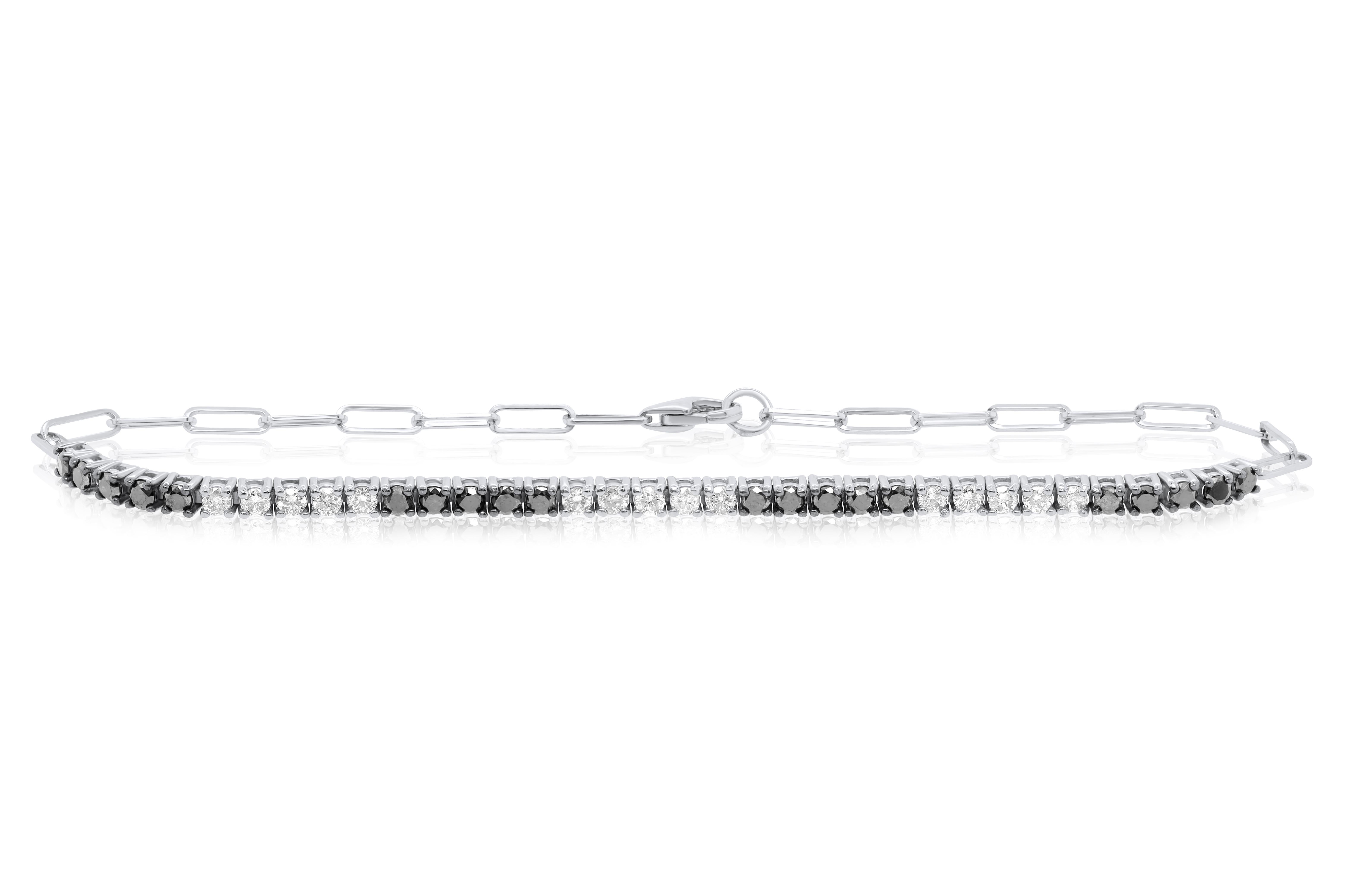 14kt white gold fashion bracelet featuring 0.50 cts tw of white diamonds and 0.65 cts of black diamonds in a 4 prong setting GH SI