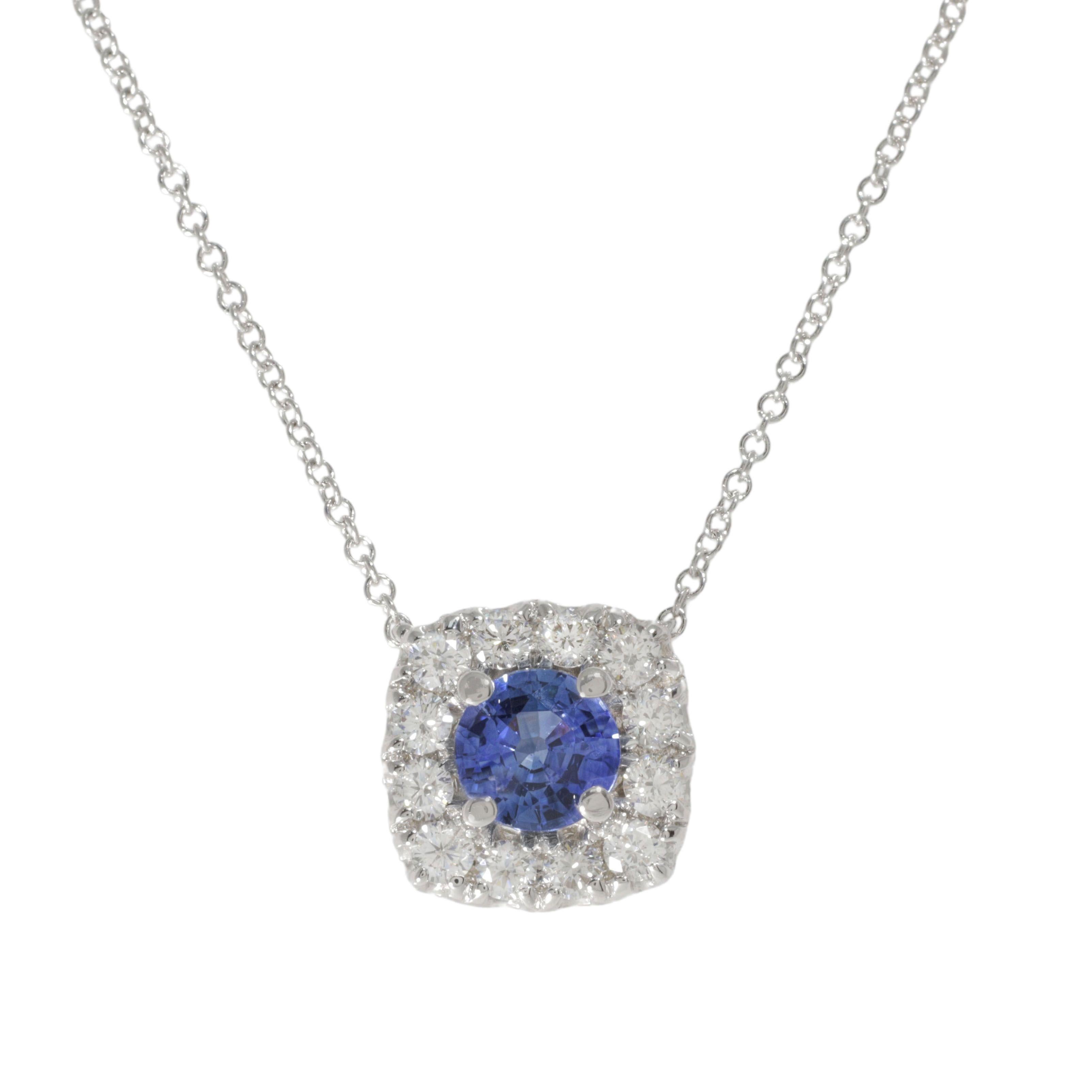 14 kt white gold diamond pendant with halo design featuring 0.85 cts tw round sapphire surrounded by 0.50 cts tw diamonds