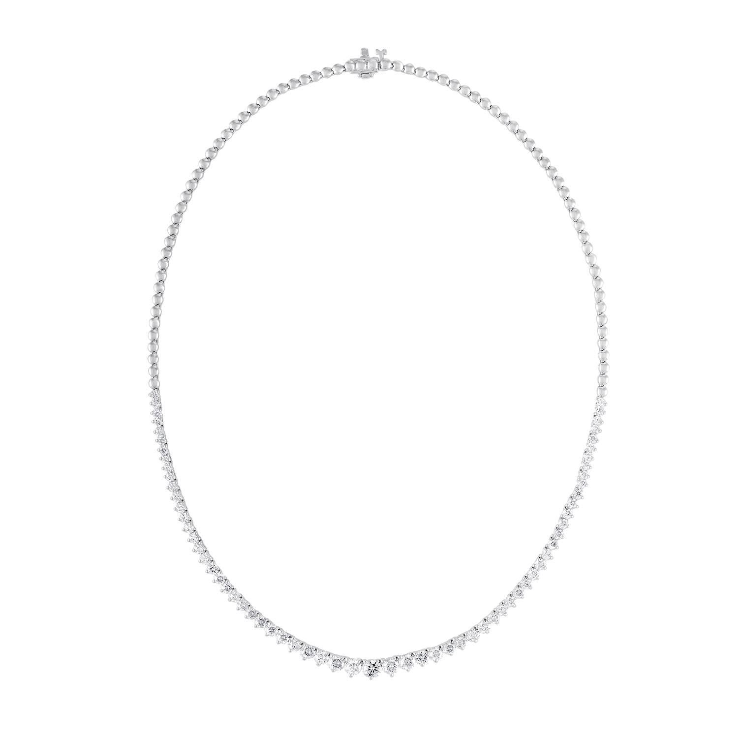 Custom 18k white gold graduated half way diamond tennis necklace containing 5.00 cts of round brilliant cut diamonds.Color FG SI clarity. Excellent cut 
