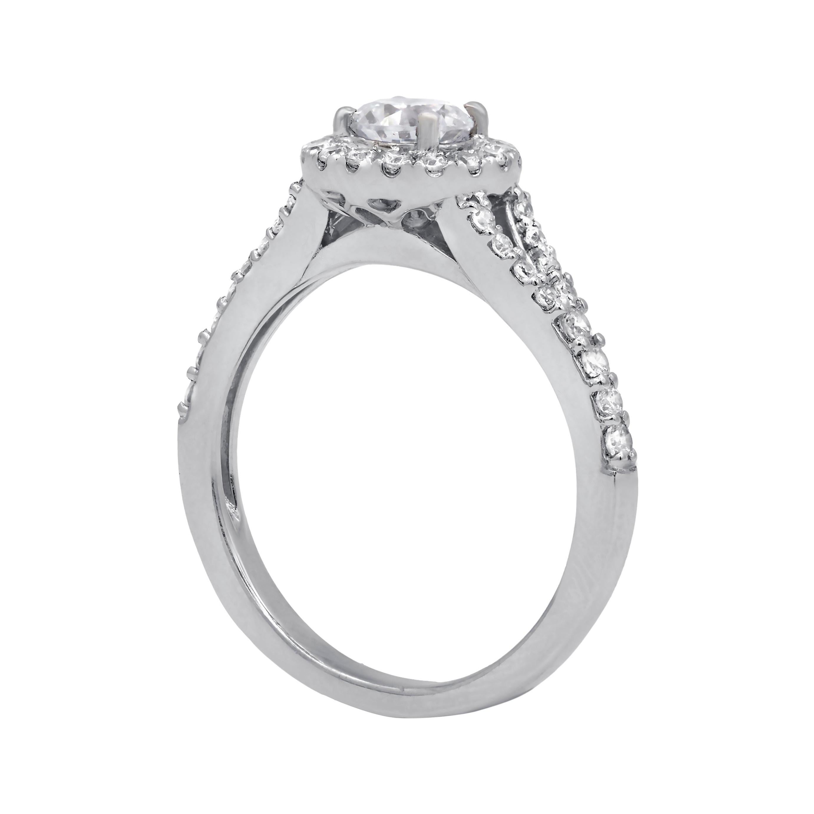 14kt diamond ring center .35ct round shape diamond in a halo and split shank setting .55cts of diamonds
