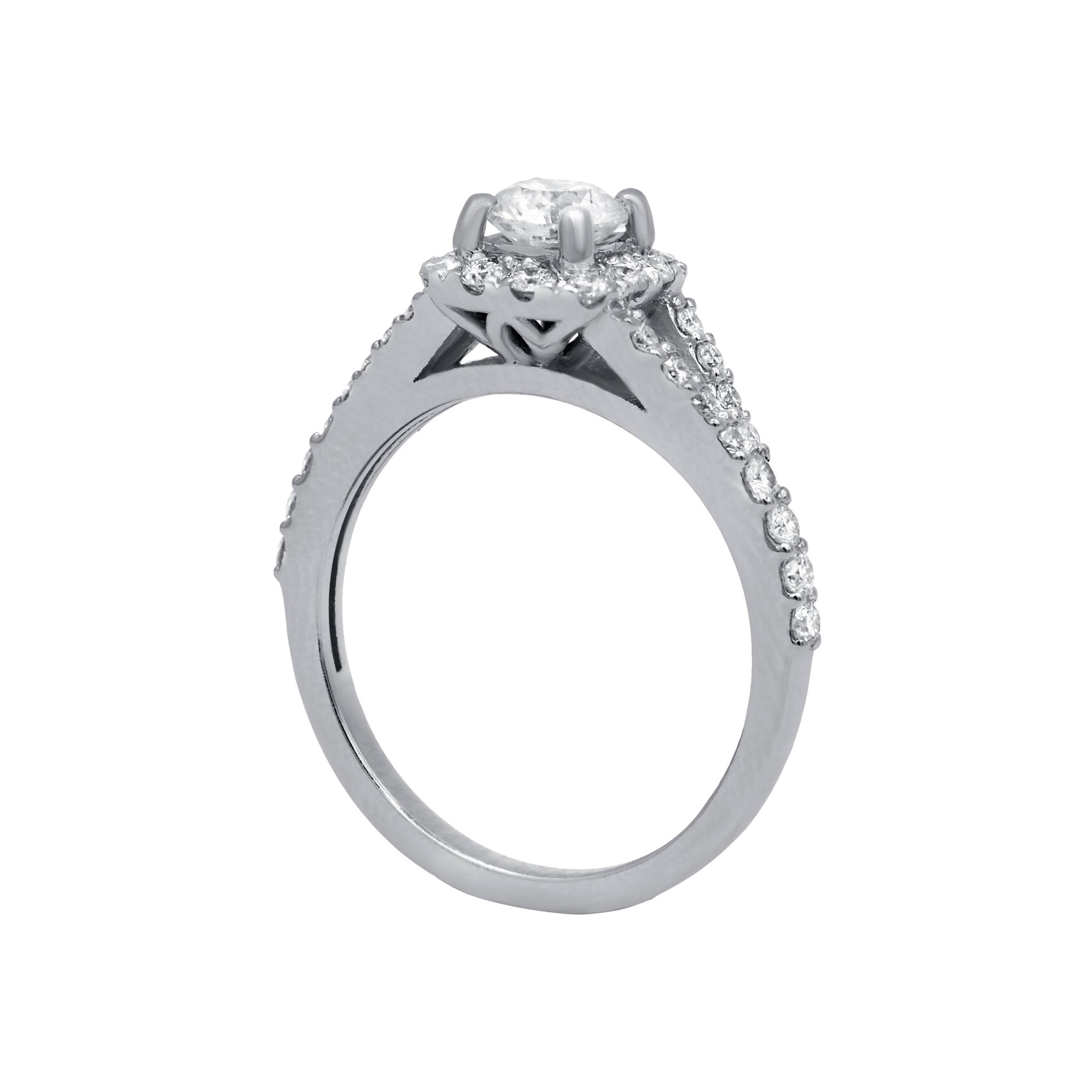 14kt diamond ring center .51ct round shape diamond in a halo and split shank setting .60cts of diamonds
